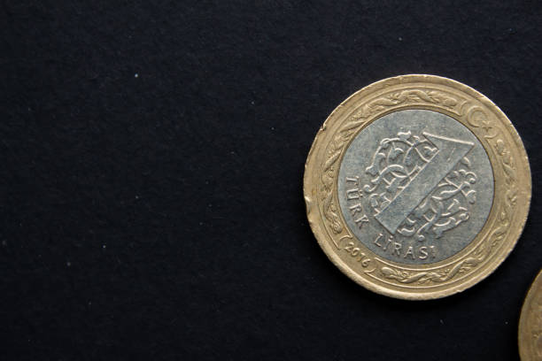 istock Turkish lira coins on black background 1488878084