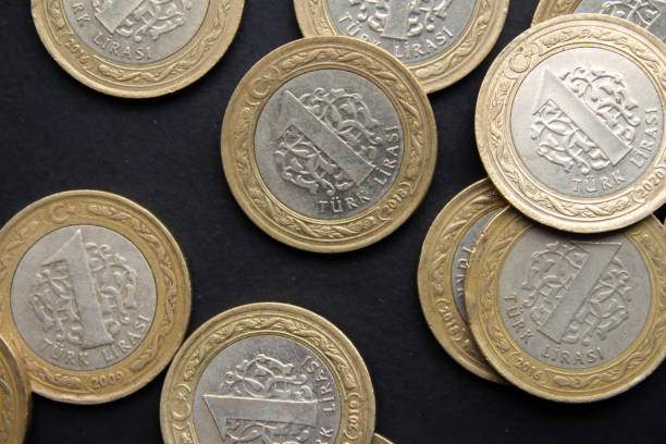 istock Turkish lira coins on black background 1488878148