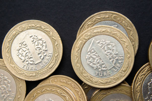 istock Turkish lira coins on black background 1488878325