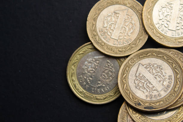 istock Turkish lira coins on black background 1488878359