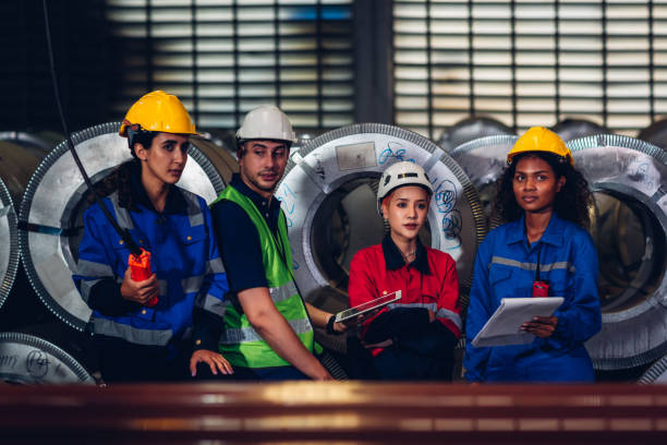 istock Foreman or worker work at factory site check up machine or products in site. 1488882574