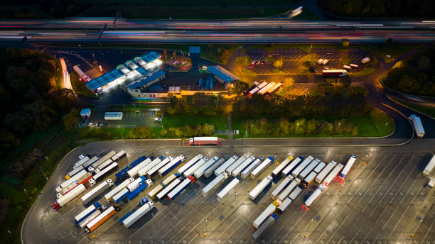 istock Highway and rest area at dusk - aerial view 1488884110