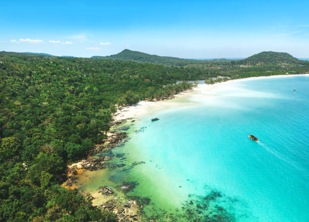 istock Long deserted beach with white sand and clear water 1488884330