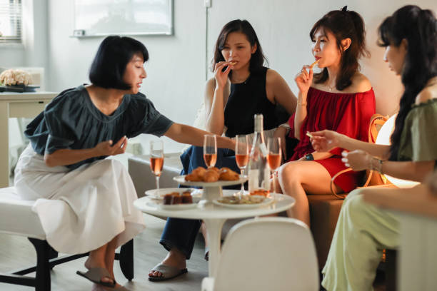 istock Women talking over champagne 1488884635