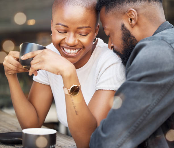 istock Love, black couple and affection in cafe, happiness and relationship with celebration, Valentines day and romance. Romantic, man and woman in coffee shop, loving and bonding while on dating and happy 1488885113