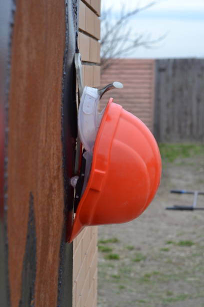 istock An orange helmet hangs on the doorknob 1488887035