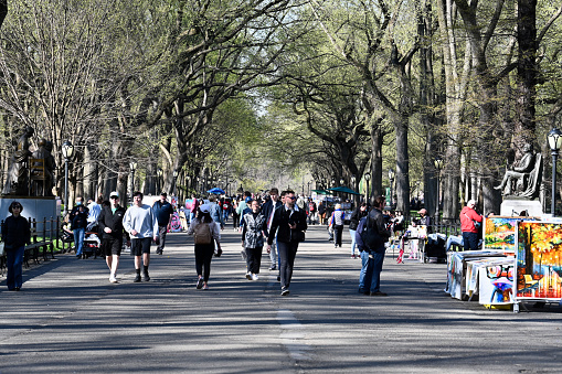 New York, USA, April 10, 2023 - Tourists and locals stroll along the Mall and Literary Walk in Central Park, midtown Manhattan, New York.