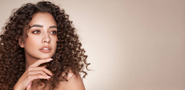 istock Beautiful smiling woman with afro curls 1488888661