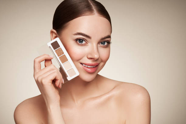 istock Beauty woman with eye shadow makeup palette 1488888769