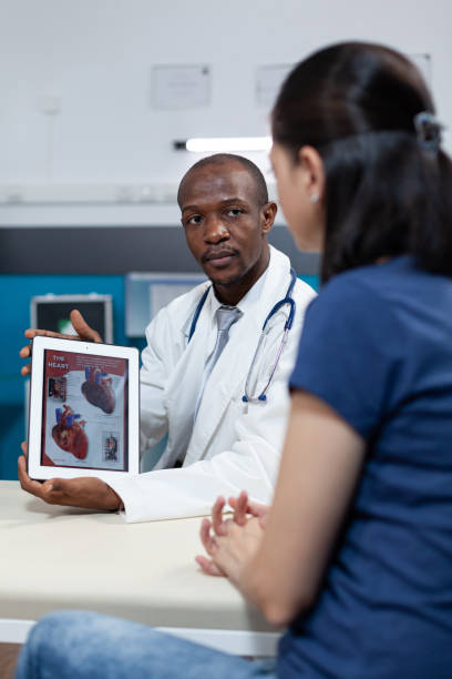 istock African american pediatrician doctor holding tablet computer in hands 1488889298