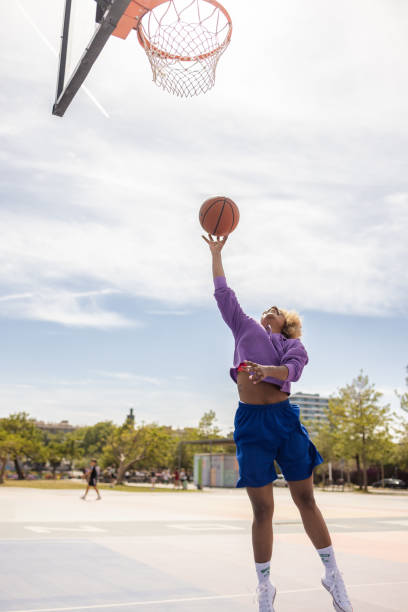 istock Woman playing street basket 1488894087