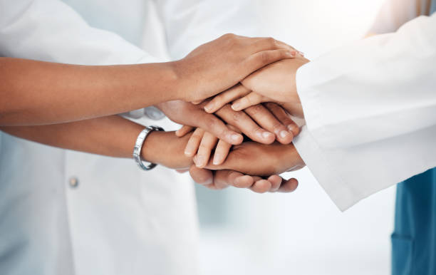 istock Support, medical and teamwork with hands of doctors for community, collaboration and diversity. Mission, healthcare and goal with stack and group of people for motivation, medicine and solidarity 1488894213