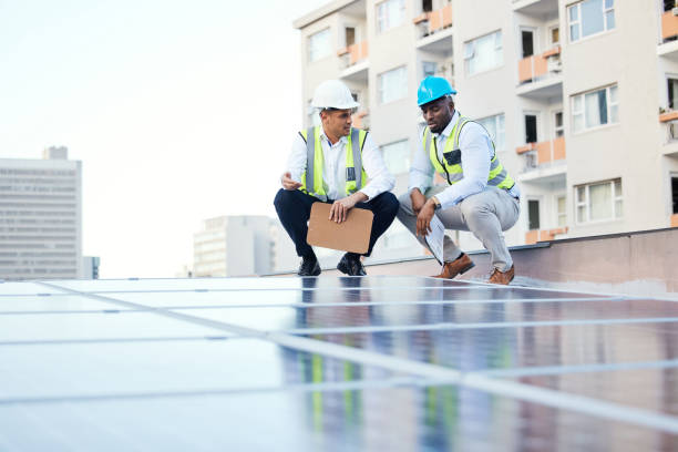 istock Solar panels, engineering people and rooftop inspection of energy saving, urban development or electricity. Teamwork, checklist and technician men with sustainable power solution or city installation 1488894287