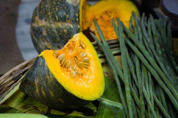 Sliced raw pumpkin kept in vegetable store for selling.