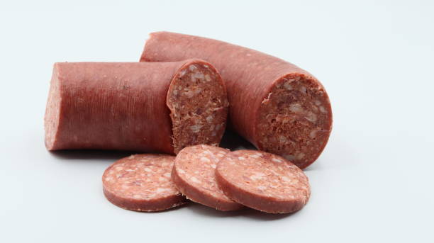 istock sliced sausage pieces on a white background. close-up. 1488895944