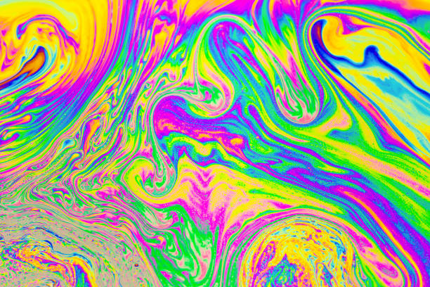 istock Psychedelic multicolored background abstract. Rainbow colors. patterns background. Photo macro shot of soap bubbles 1488897490