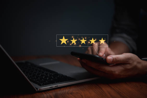 istock Customer satisfaction service, five star shape on a virtual digital screen with smartphone concept of surveying rating satisfaction, quality feedback review, evaluation good product service . 1488897504