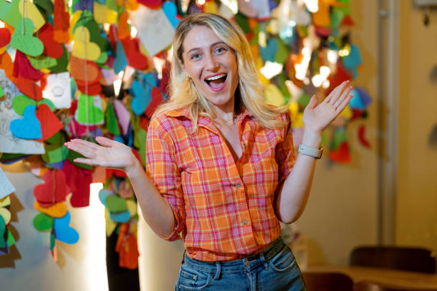 istock Confused woman spreads her hands in cafe 1488898577