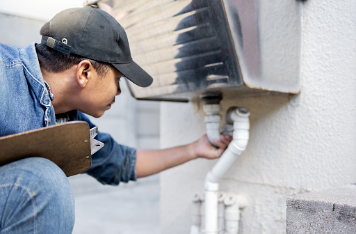 Man, plumber and check faucet pipes for building maintenance, renovation and builder service. Handyman, pipeline and plumbing inspection for leak, drainage and installation of system, sink and repair