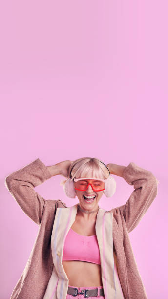 istock Fashion, comic and a woman with mockup in studio while laughing for funny space on pink background. Aesthetic model person with glasses for edgy vaporwave trend with creativity and color advertising 1488899033