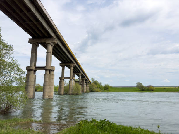 istock A long bridge over the river connects the two banks 1488901194