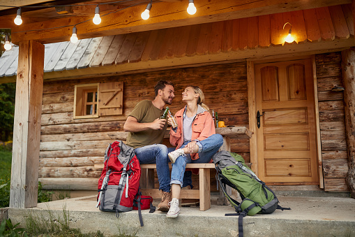 Adorable couple spending romantic weekend together in a mountain cottage