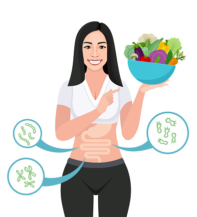 Asian Woman showing a bowl full of fresh organic vegetables. Happy woman with balanced gut flora.