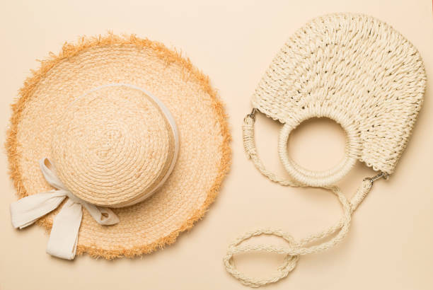 istock Straw hat and bag on color background, top view 1488902943