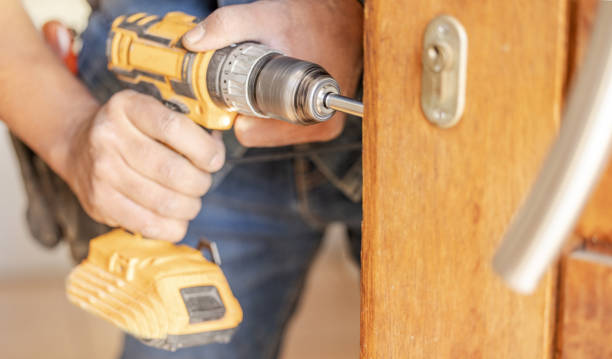 istock Locksmith hands, maintenance and handyman with construction and fixing, change door locks with tools and closeup. Home renovation, industry and trade with manual labour, drill with vocation and work 1488903547
