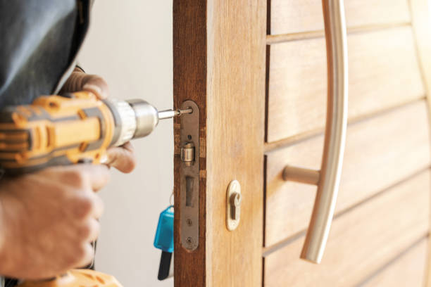 istock Locksmith hands, maintenance and handyman with drill, home renovation and fixing, change door locks and power tool. Construction, building industry and trade with manual labour, vocation and employee 1488903557