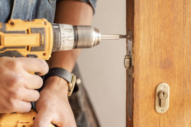 istock Handyman, drill door and wood for handle at workplace, industry and home development goals. Hands, tools and construction worker with maintenance, property management and diy carpenter for building 1488903561