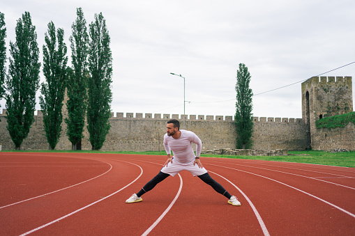 Man Warming Up Before Workout and Running