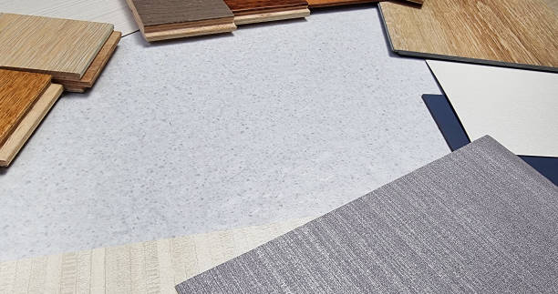 istock interior material samples in close up perspective view contains fabric wallpapers, wooden laminated flooring tiles, wooden vinyl tile, solid color laminated placed on stone tile with space for design. 1488905988