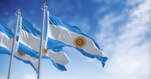 istock Three Argentine flags fluttering in the wind on a sunny day 1488906329