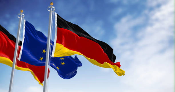 istock Germany and EU flags waving in the wind on a clear day 1488906344