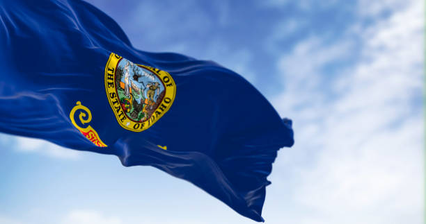 istock Idaho state flag fluttering in the wind on a clear day 1488906367