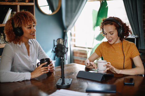 Women discussing themes on a podcast from their studio in Los Angeles, California.