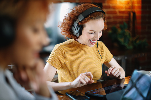 Women discussing themes on a podcast from their studio in Los Angeles, California.