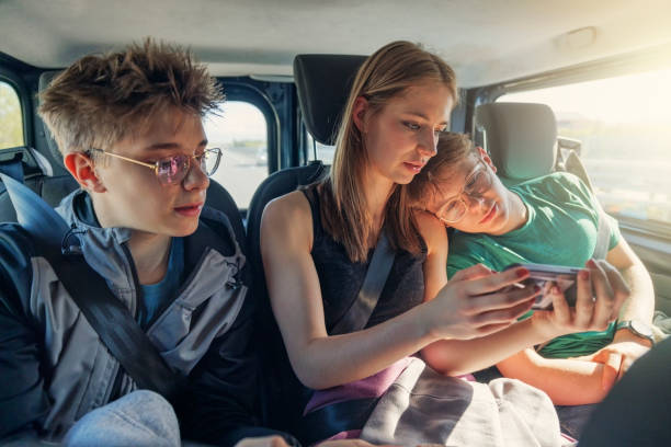 istock Three teenagers travelling by car 1488909350