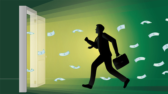 A young businessman runs towards an illuminated open door and paper money coming out of the door.