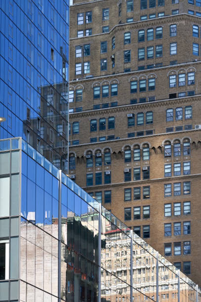 New York City - February 15, 2023: Modern and vintage office buildings reflecting in Manhattan, New York City, United States