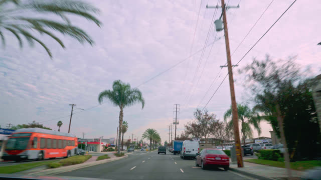 Shaky Passenger's Seat in a Car Point of View Driving Ocean Boulevard in Long Beach, Los Angeles, California on an Overcast Day