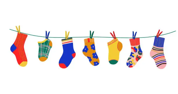 Vector illustration of Socks on a rope with colored clothespins