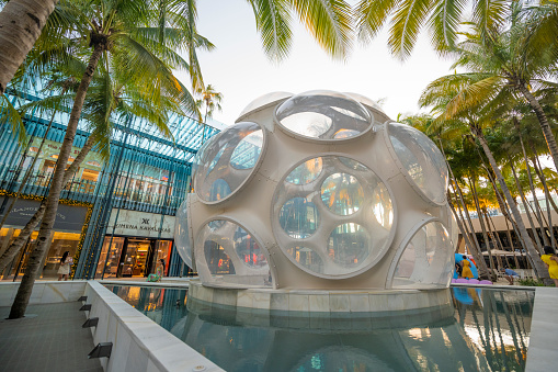 In Miami, USA the Buckminster Fuller's Fly's Eye Dome is a landmark in the Design District neighborhood and is surrounded with palm trees and shops.