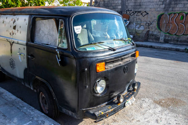 Playa del Carmen Quintana Roo Mexico 04. April 2021 Old black broken dirty VW bus Volkswagen car rusting on the roadside in Playa del Carmen Quintana Roo Mexico.