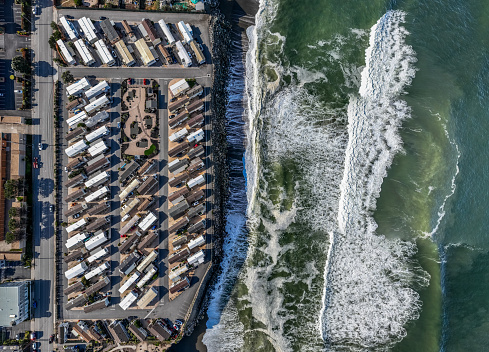 High quality aerial stock photo of a mobile home park along the coast in Norther California.