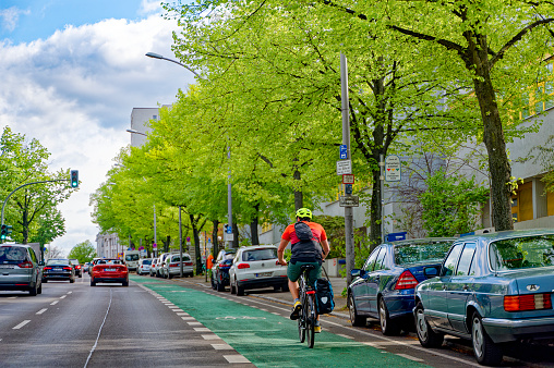 Berlin, Germany - May 7, 2023: Street scene with a cycleway in downtown Berlin.