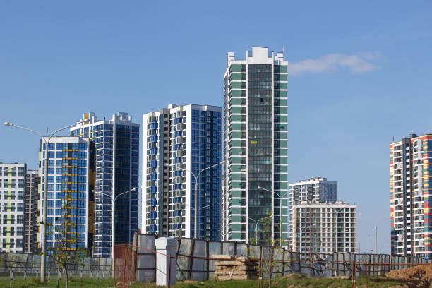 istock Construction site. Reinforced concrete frames of multi-storey buildings and construction cranes. The final stage of construction. Against the background of the blue sky. 1488916283