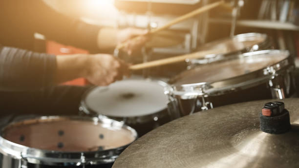 istock Hands playing drums with drumsticks with rock beat, hihat rythm 1488917173
