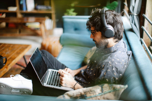 man working from his home in Los Angeles, California stock photo